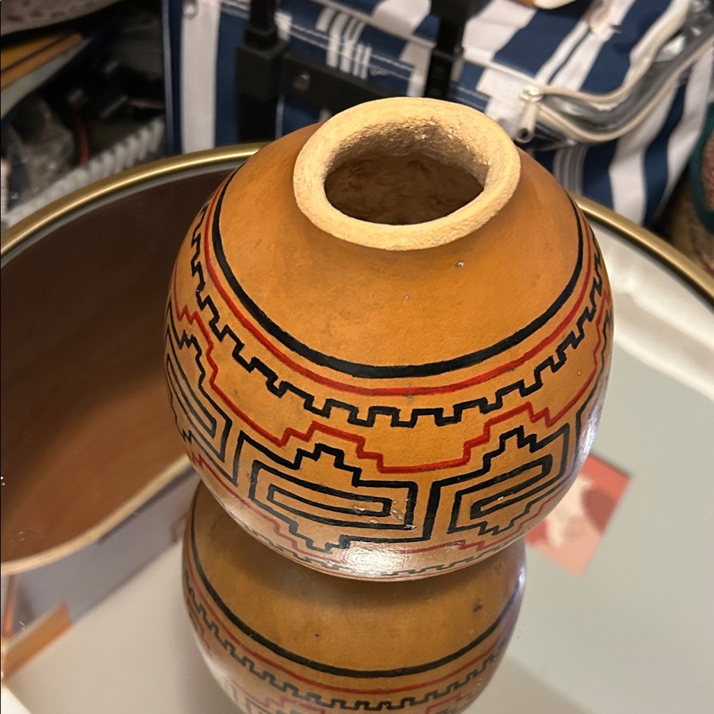 hand-painted gourd, likely a piece of Native American art.